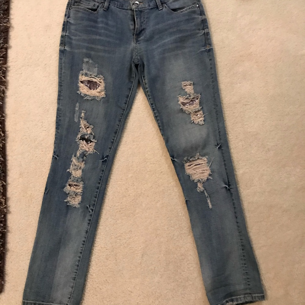 size 29 jeans w/sequins in the rips.